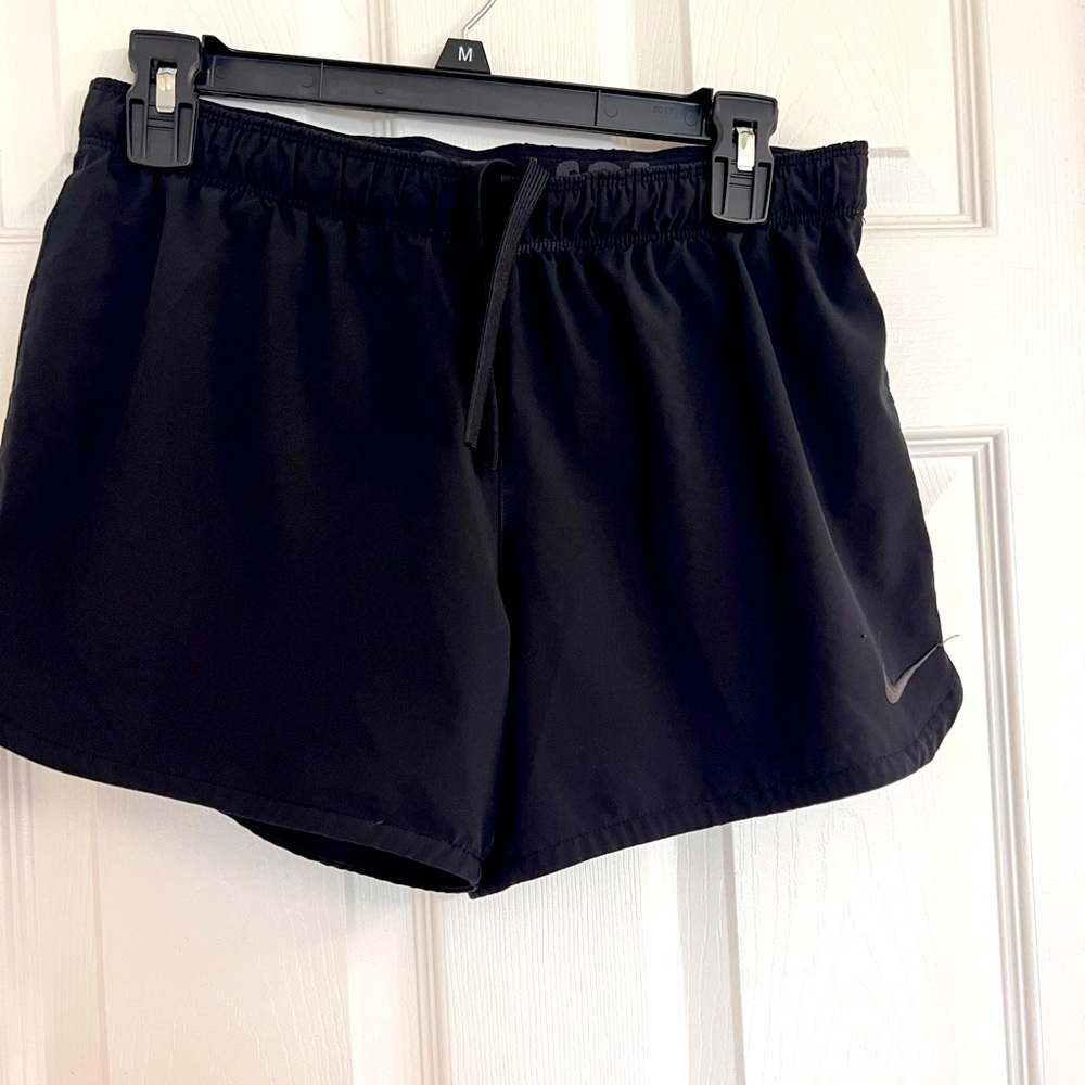 Nike Small shorts with built in shorts underneath and drawstring.